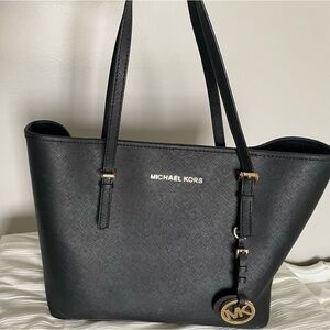 Authentic Michael Kors black leather tote bag.